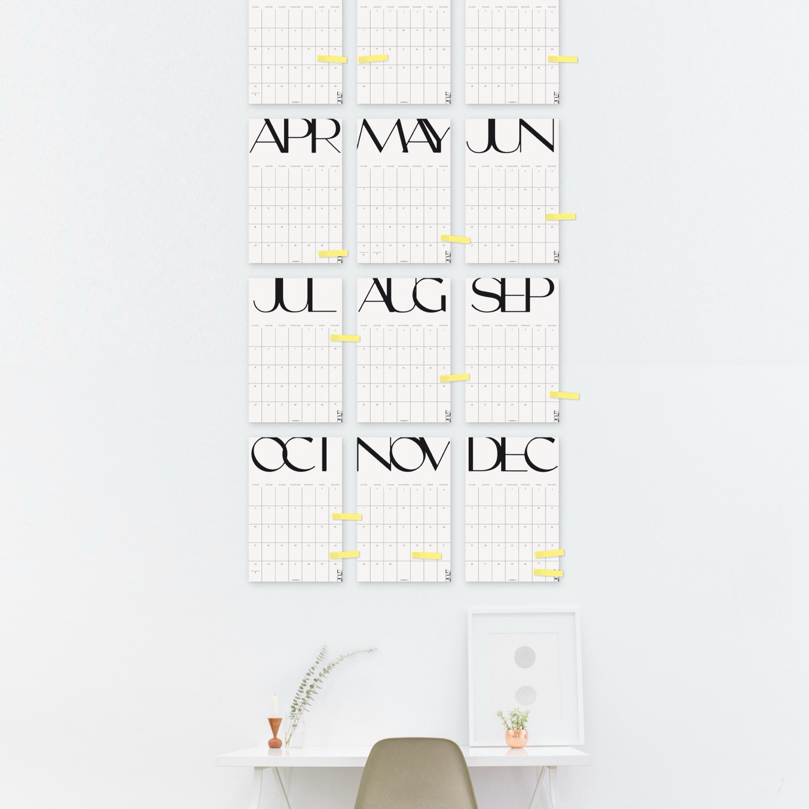 All twelve months, three across, above a desk