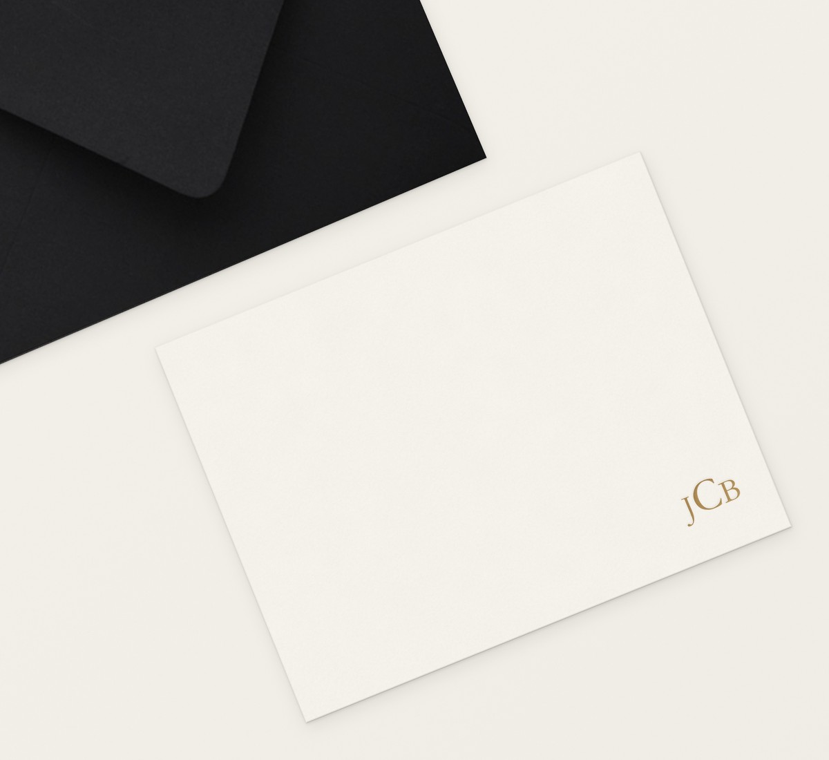 Heirloom flat note in gold foil with an ebony envelope